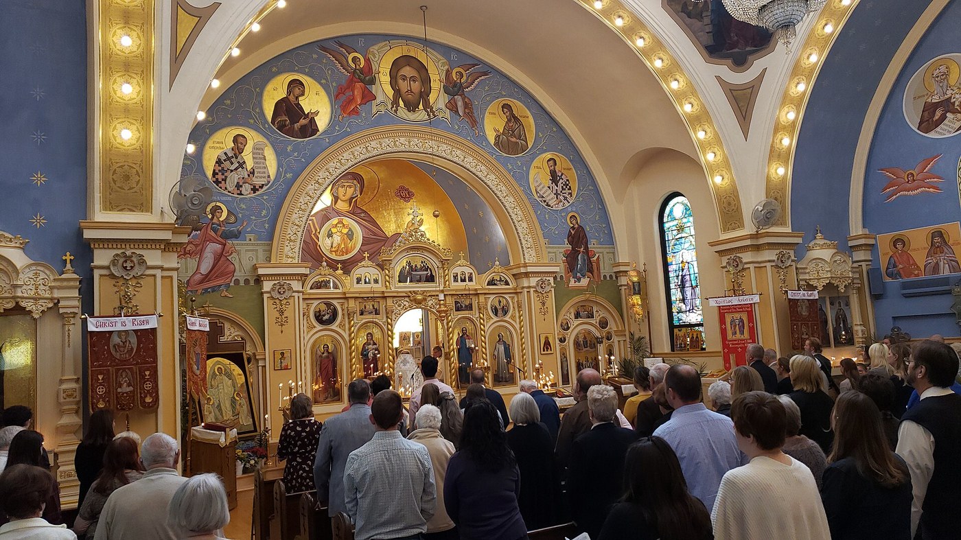Congregation standing during the Divine Liturgy at St. Mary's Orthodox Cathedral, Minneapolis, facing the iconostasis